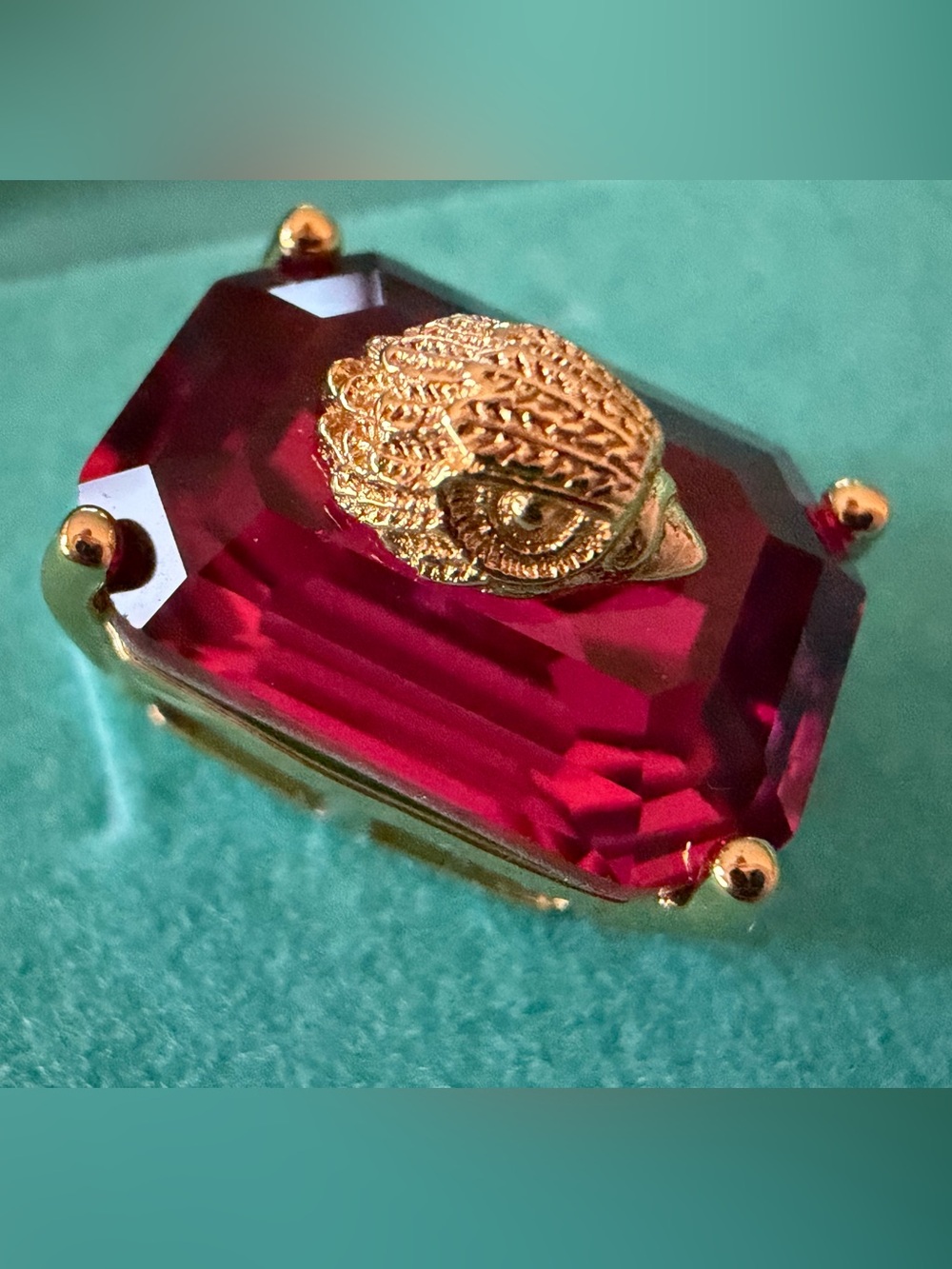 Kurt Geiger London emerald-cut crystal stud earrings are in a vibrant fuchsia